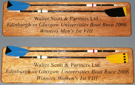 Horizontally mounted oars for the winning crews of
  the Edinburgh vs Glasgow Universities Boat Race.